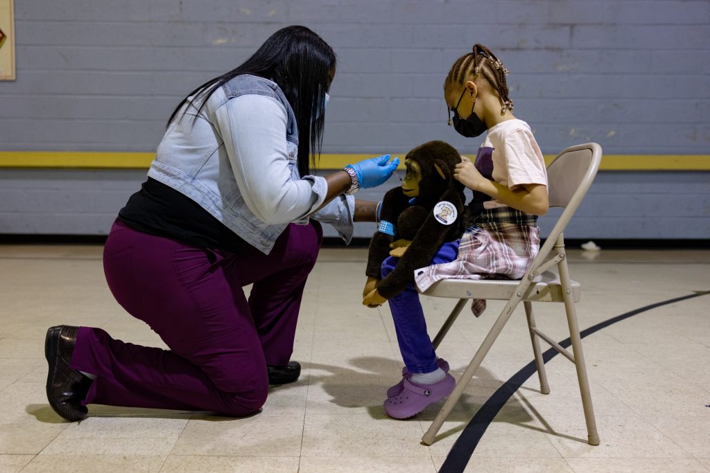 A healthcare worker pretends to administer a dose of the Pfizer-BioNTech Covid-19 vaccine to a child's stuffed animal at a Salvation Army vaccination clinic in Philadelphia, Pennsylvania, U.S., in this file photo dated November 12, 2021.